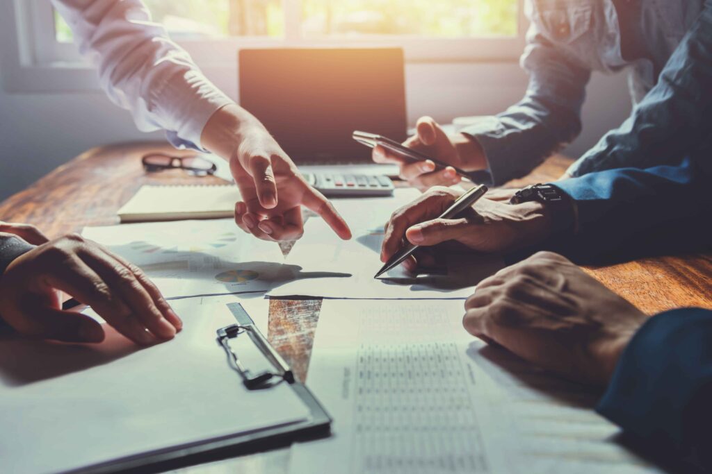 vecteezy_business-accounting-team-meeting-in-room-office-using-pen_8700984 (1)